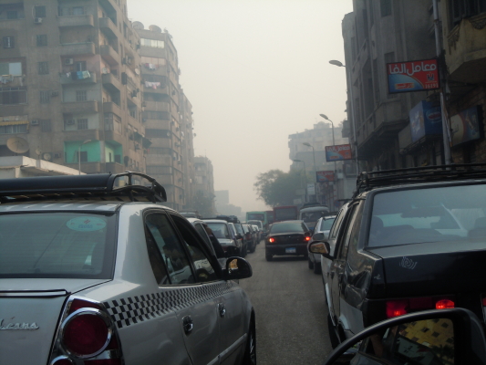 Dazed and Confused by Cairo traffic. You need four hands: steering wheel, turn signal, horn and gear shift.